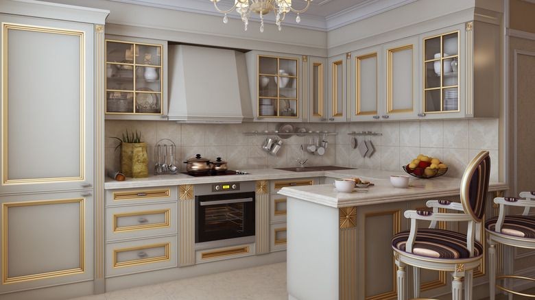 Luxury kitchen with two-tone WPC cabinetry, quartz countertops, and integrated LED lighting