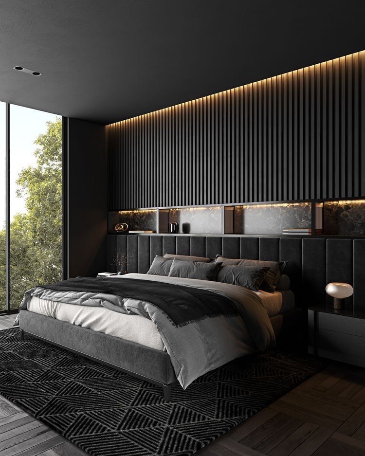 Luxury master suite featuring floor-to-ceiling WPC panels, a tufted bed, and gold-toned lighting